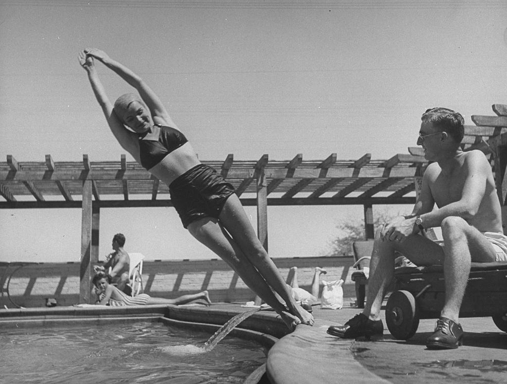 Ella Raines perfoming a side belly flop.