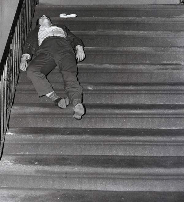 George Silva, 19, lies on the steps of a rooming house, dead after inhaling heroin, 1954