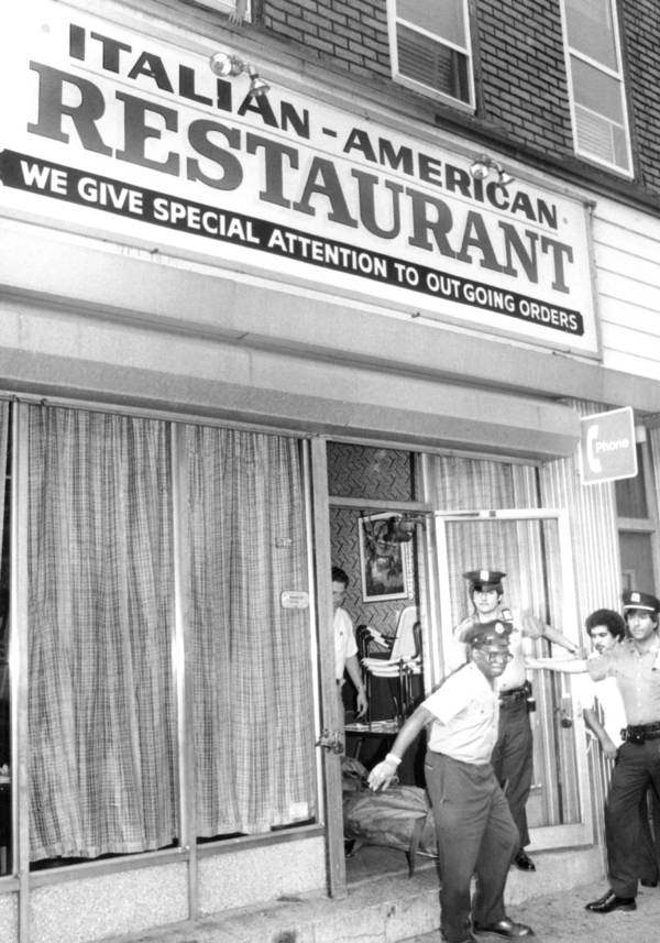 Morgue attendants carry the body of Carmine Galante out of Joe & Mary’s Restaurant on July 12, 1979