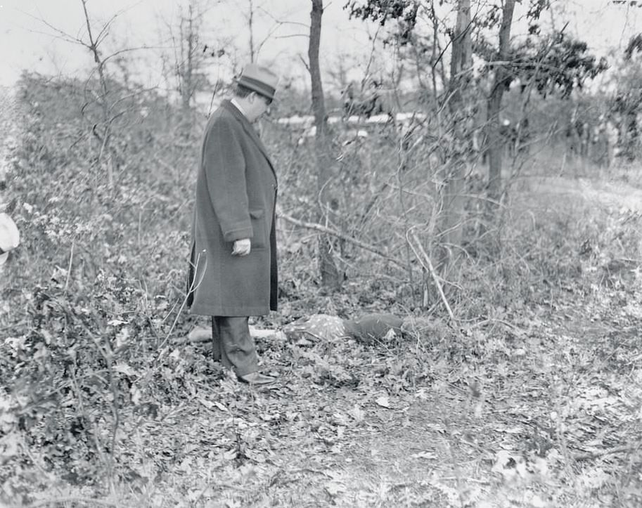 Police guarding the body of 15-year-old schoolgirl Ellen O'Connor who disappeared from her home before being found murdered and dumped in Massapequa woods