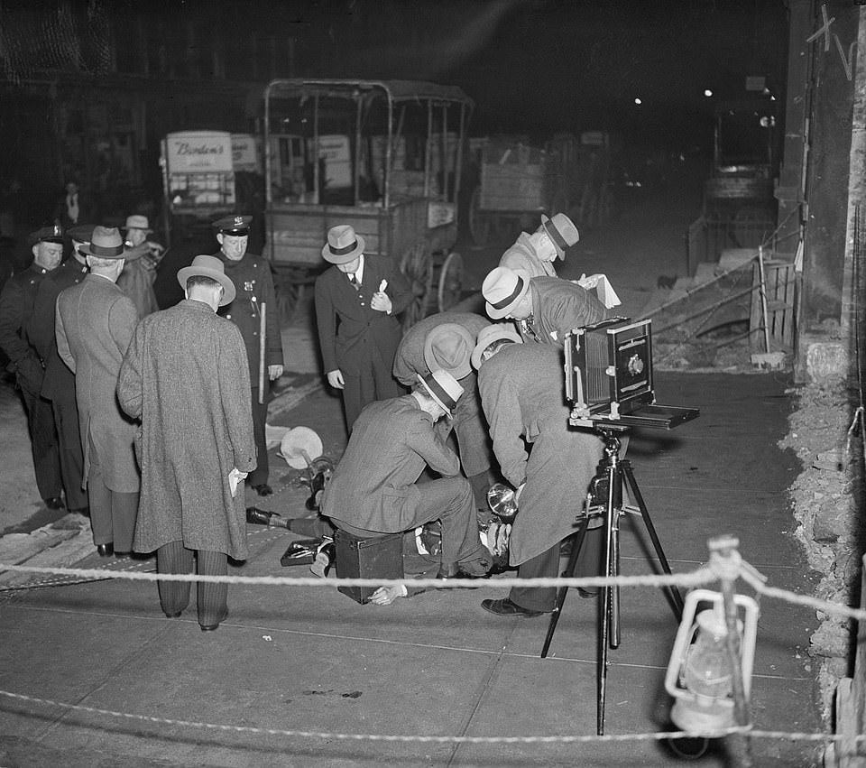 Policemen gathered  at the scene of the murder of Johnny La Polla, 1937
