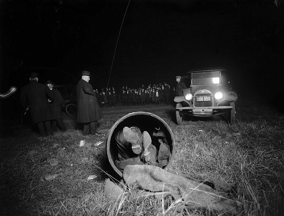 The body of a murder victim is found inside a barrel in New York circa 1916 to 1920