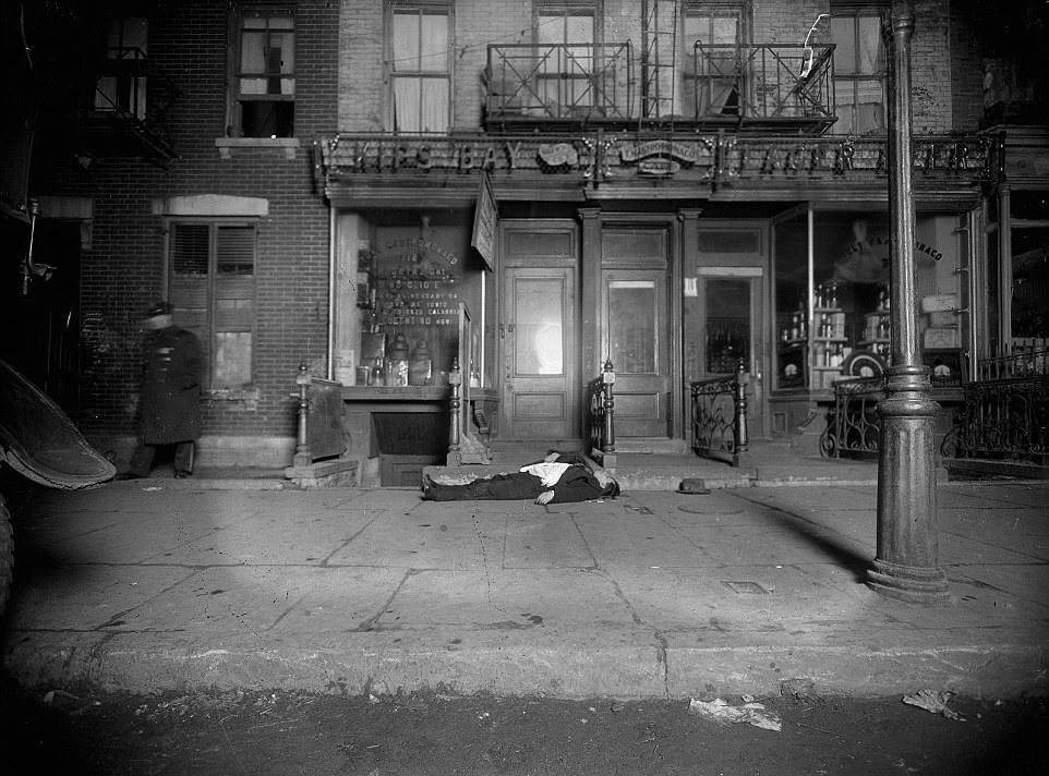 A man lies dead outside a cafe in the Kips Bay area of Manhattan circa 1910