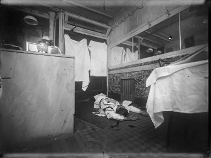 Homicide scene at a store or restaurant interior, 1916-1920