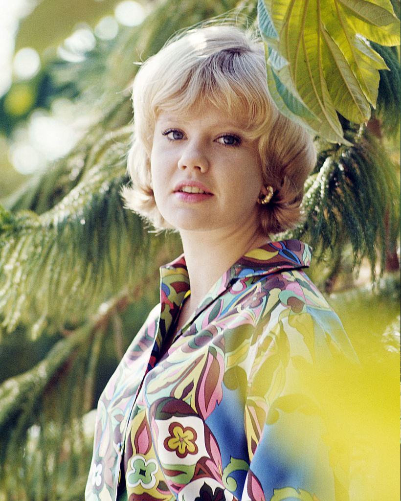 Hayley Mills wearing a brightly-coloured print pattern blouse, 1960