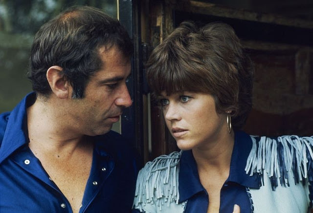 Jane Fonda with her husband Roger Vadim talking on the threshold of her office in their home