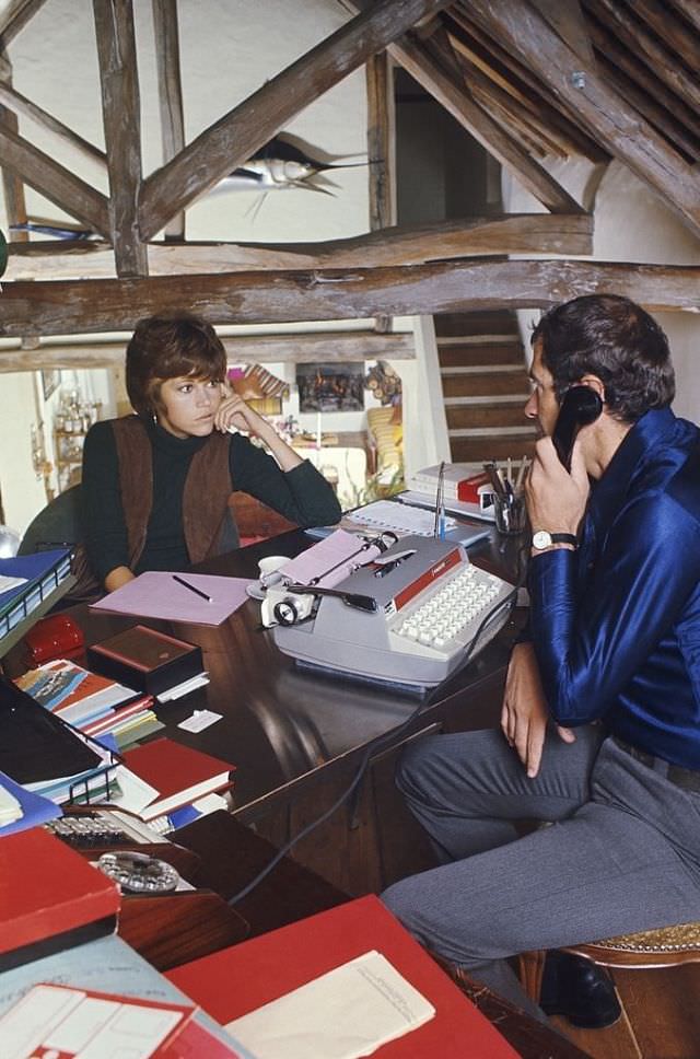 Jane Fonda with husband Roger Vadim in his office in their home.
