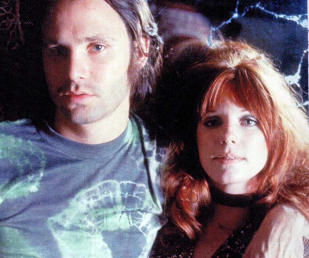 Pamela Courson and Jim Morrison in a theatre