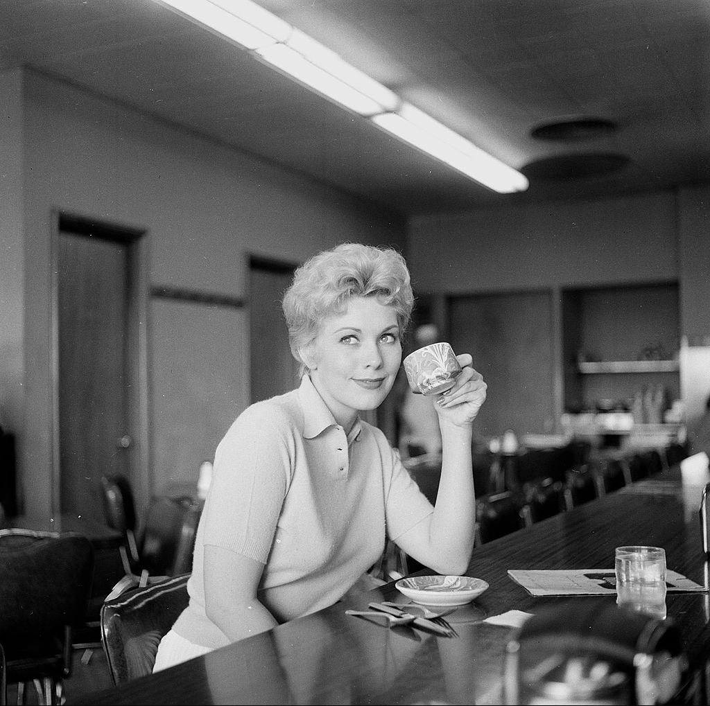 Kim Novak in a coffee shop in Los Angeles, 1955