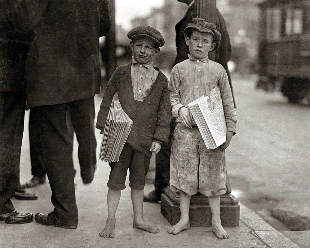 Nine-year-old newsie and his 7-year-old brother 'Red.' Tough specimen of Los Angeles newsboys, May 1915