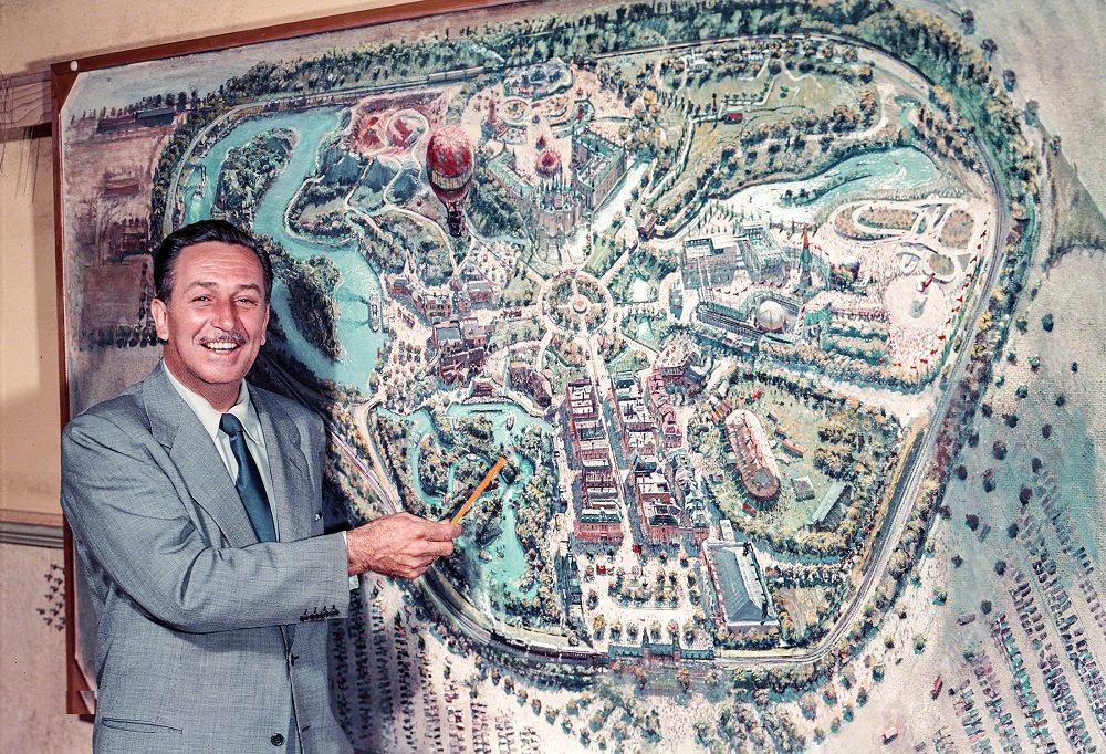 Walt Disney pointing to a plan for Disneyland, under construction in Anaheim, Los Angeles, 1954