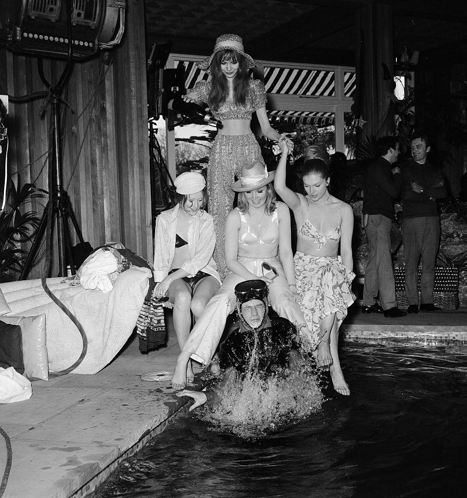 Madeline Smith with Pippa Steel, Janet Key, Geraldine de Sancha and John Hurt during the production of "Forbush and the Penguins", 1970