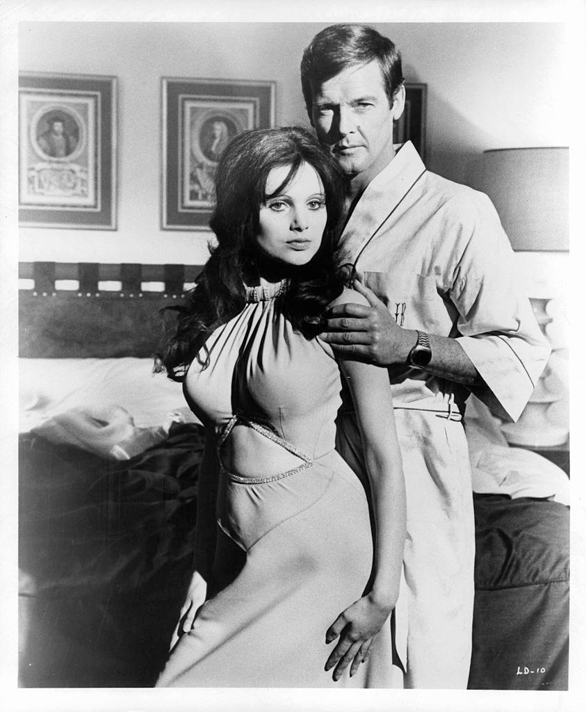 Madeline Smith with English actor Roger Moore, 1973