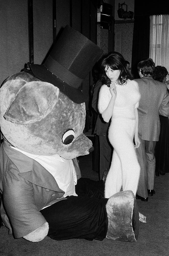 Madeline Smith picture with a giant teddy bear at a Variety Club luncheon, 1973