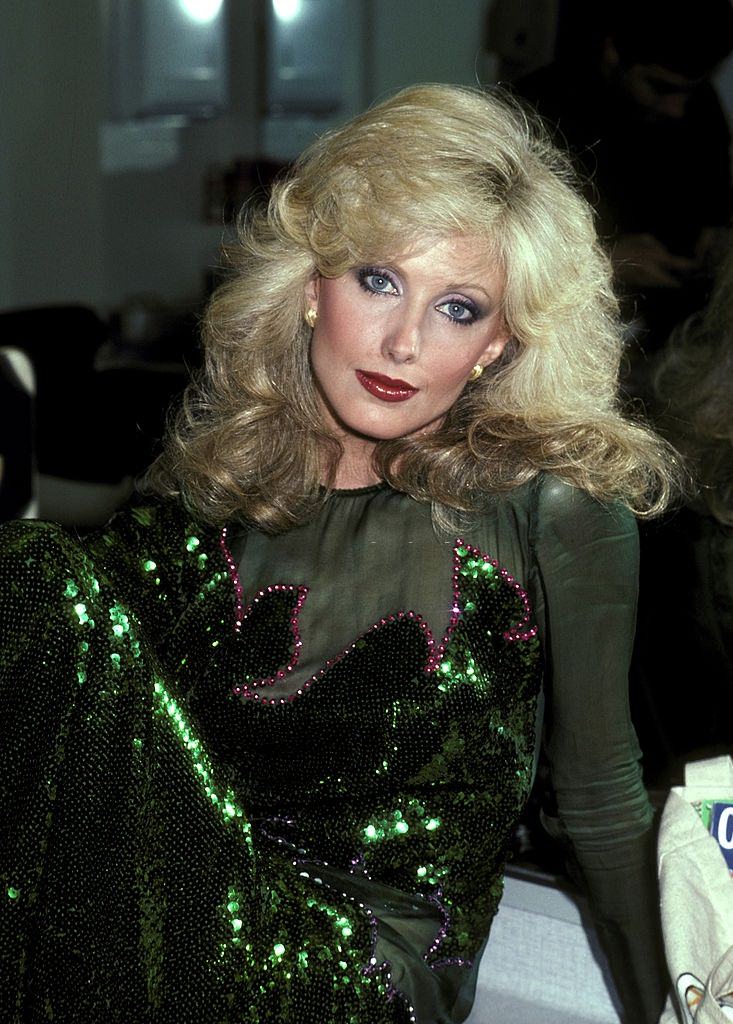 Morgan Fairchild in shiny green dress, 1981