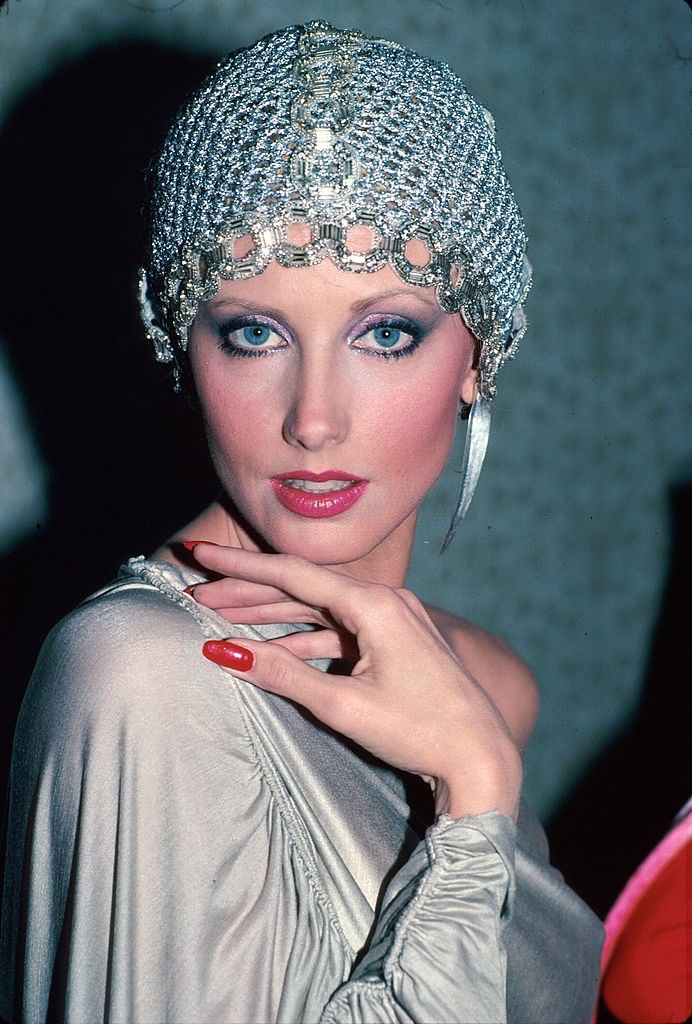 Actress Morgan Fairchild wearing mesh hat