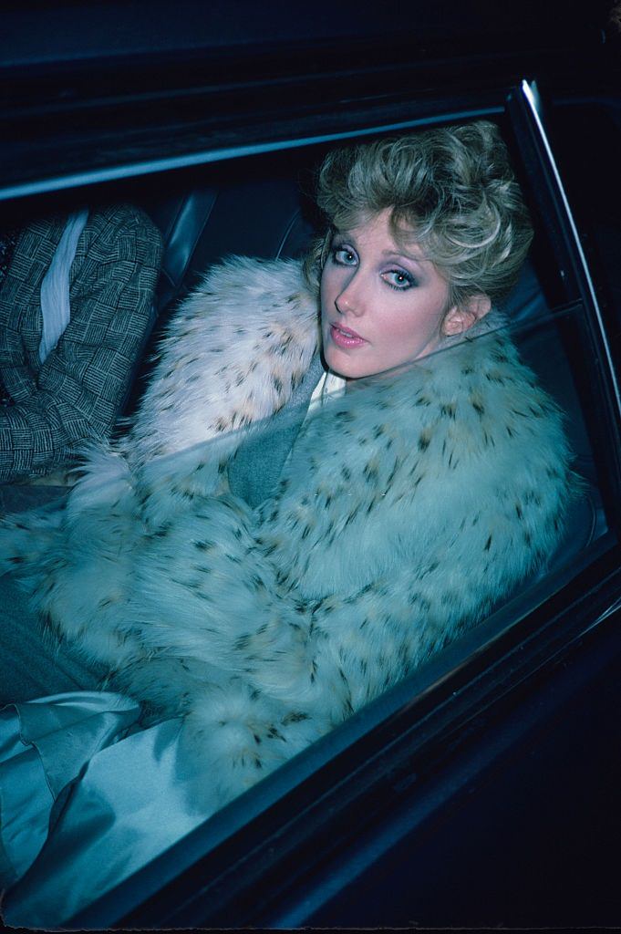 Morgan Fairchild sitting in a car in New York, 1982