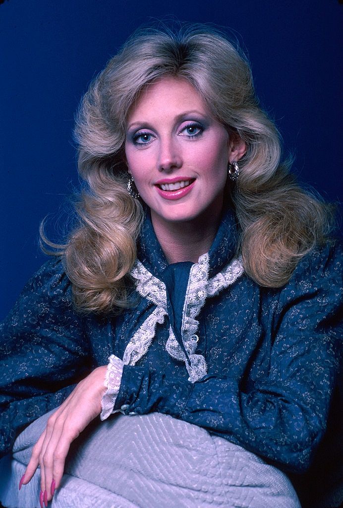 Actress Morgan Fairchild in a blue dress, 1982