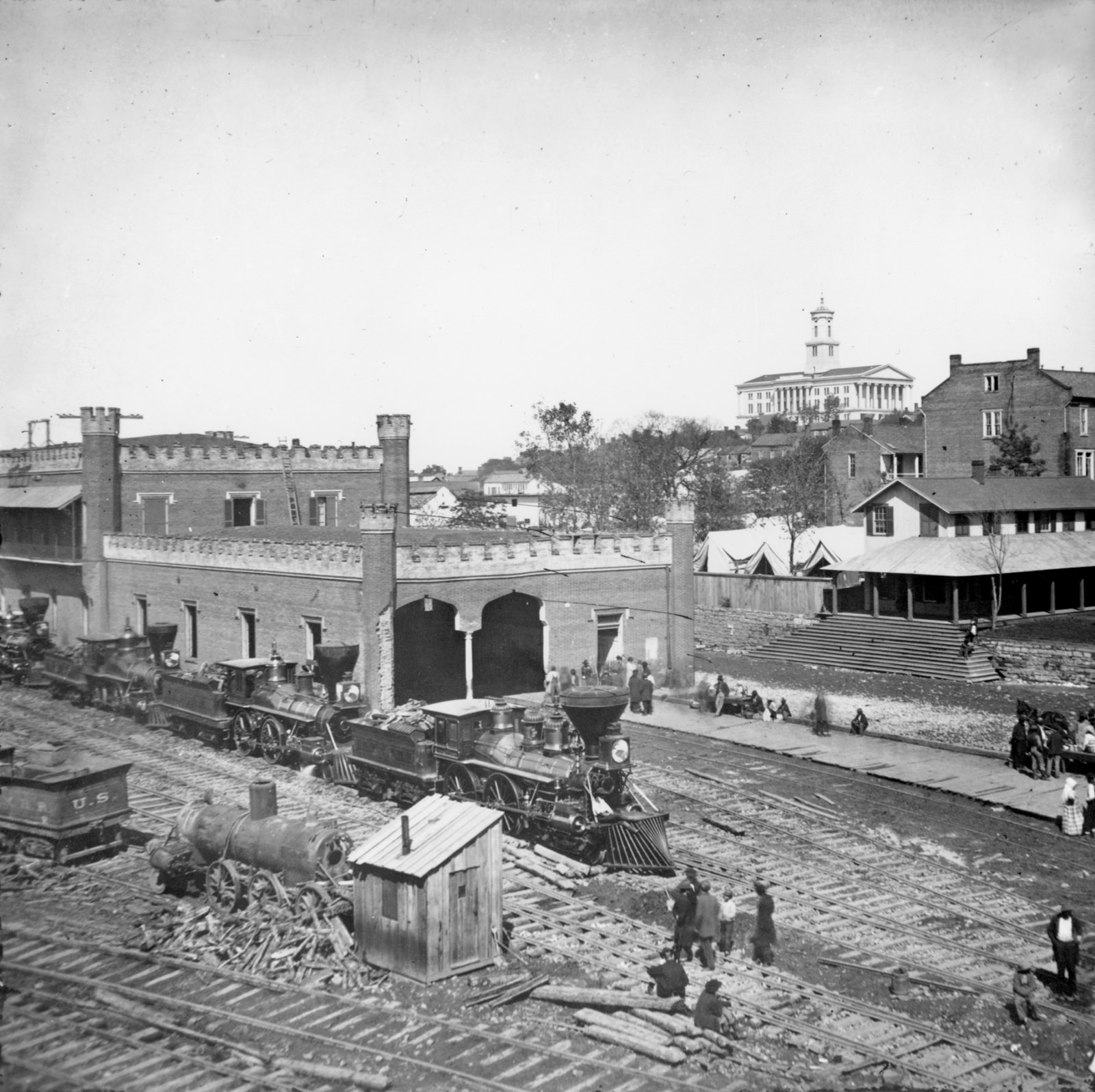 Railroad yard and depot with locomotives; the capitol in the distance, Nashville, Tenn., 1864