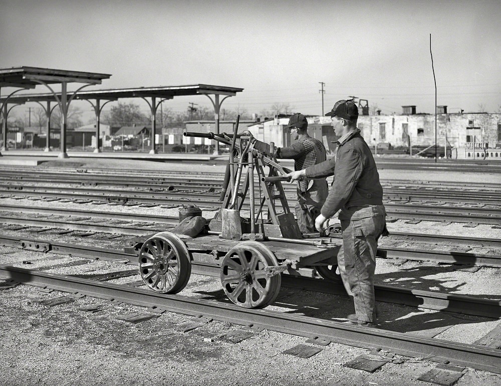 Railway workmen with handcar, Oklahoma City, Oklahoma, February 1940