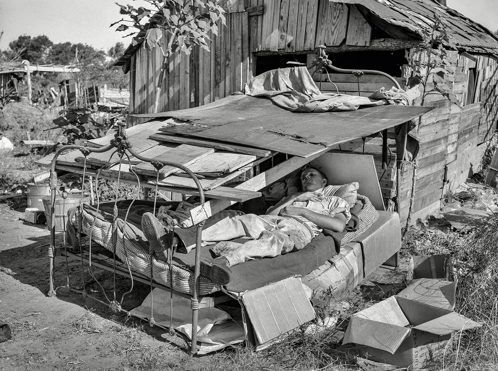 Bed with roof over it in May Avenue camp, Oklahoma City, July 1939