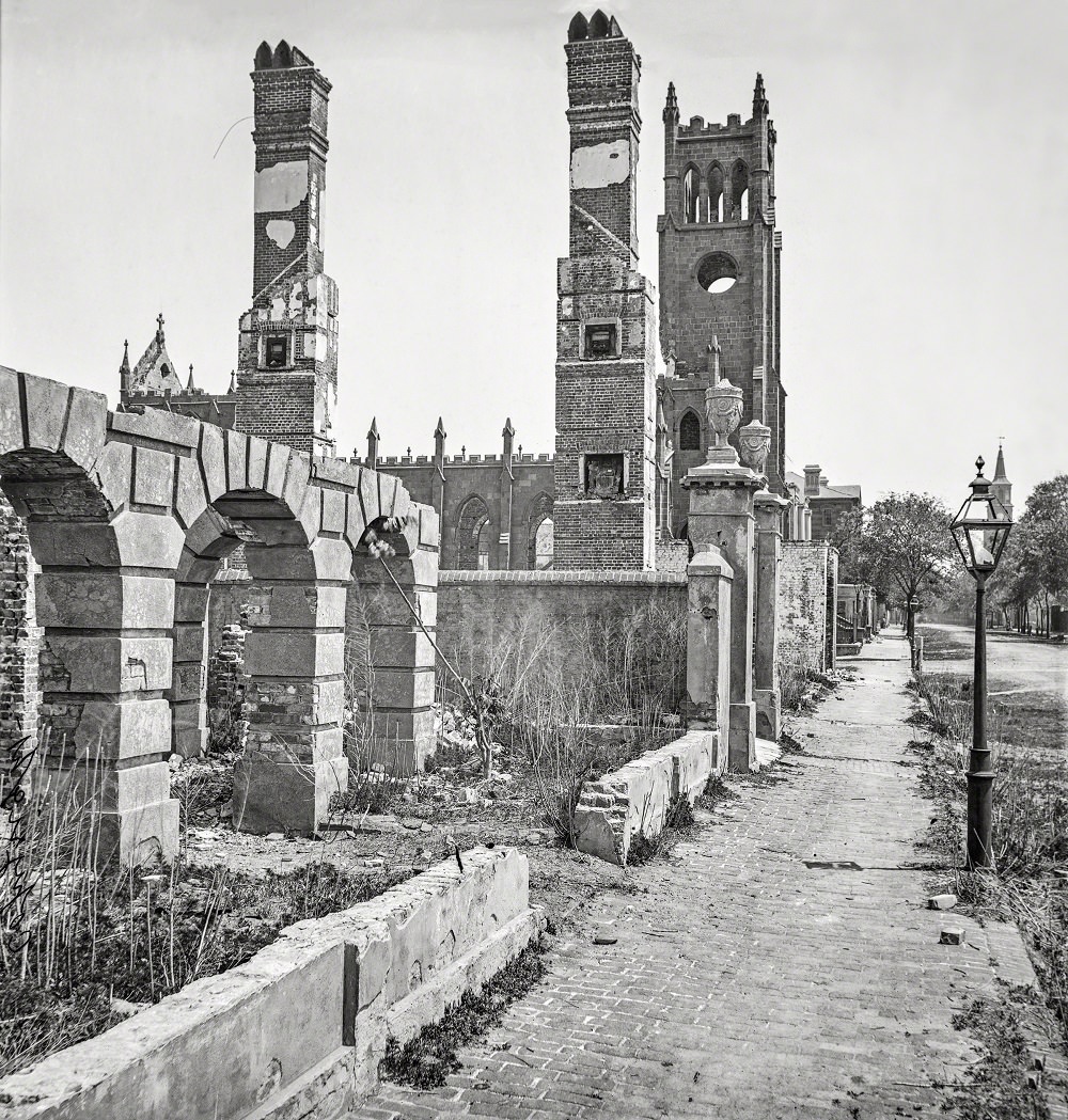 Broad Street, looking east with the ruins of Cathedral of St. John and St. Finbar, Charleston 1865