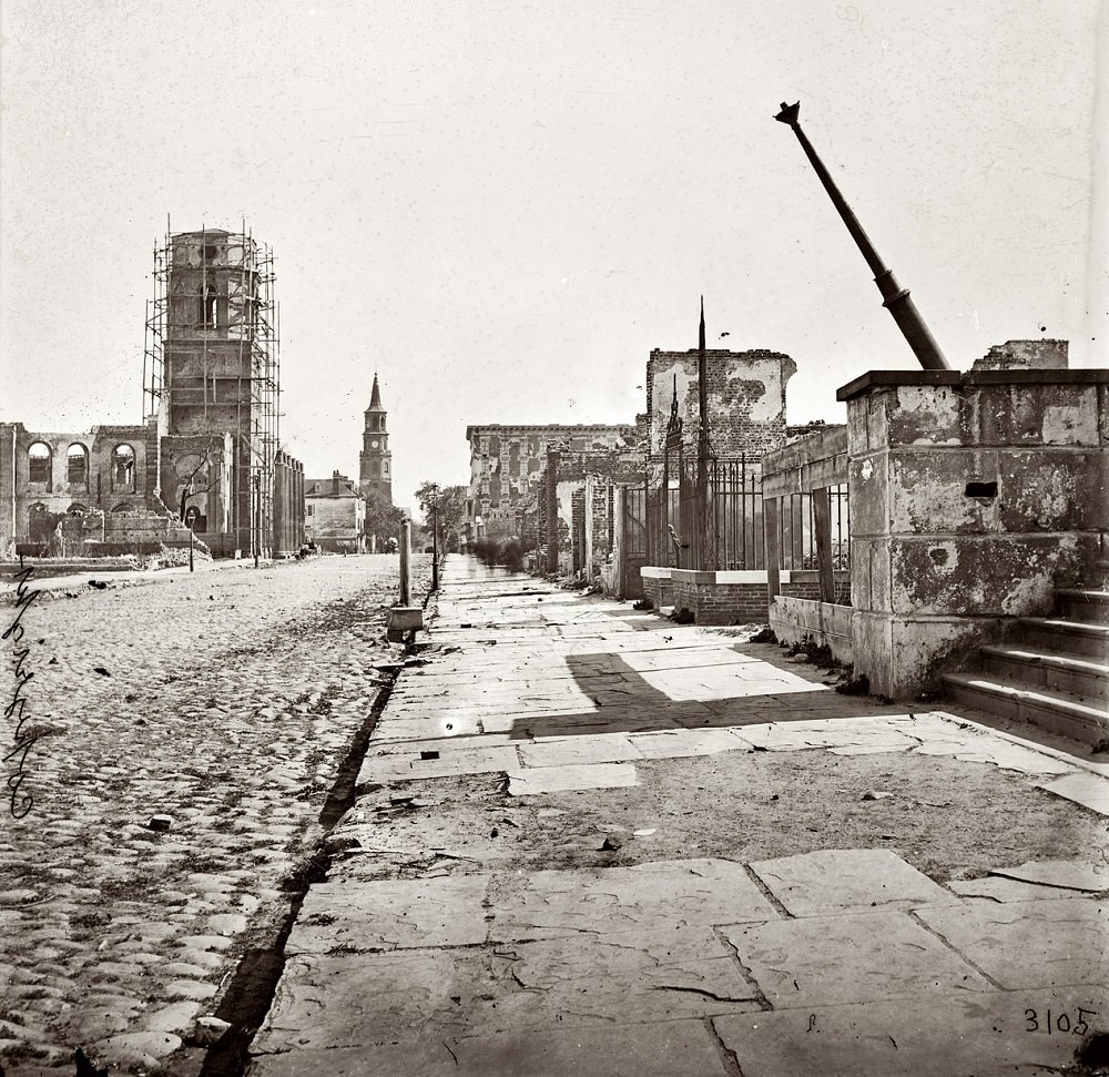 Meeting Street, looking south, showing St. Michael's Church, the Mills house and ruins of the Circular Church, 1865