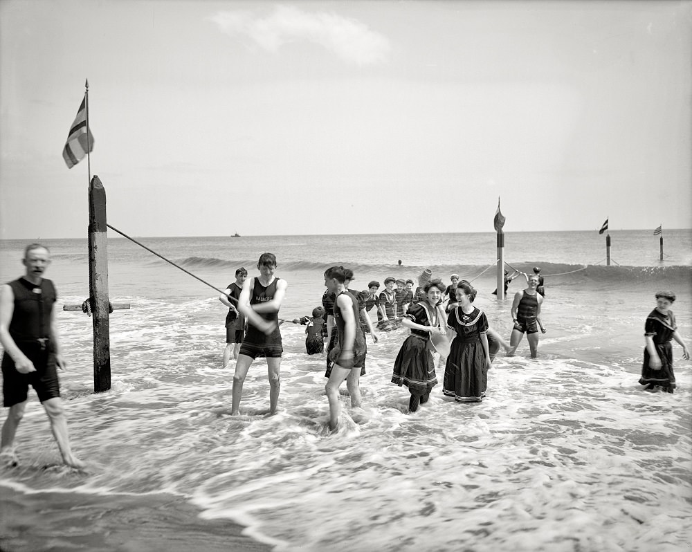 People enjoying at the Beach, Coney Island, New York, circa 1904