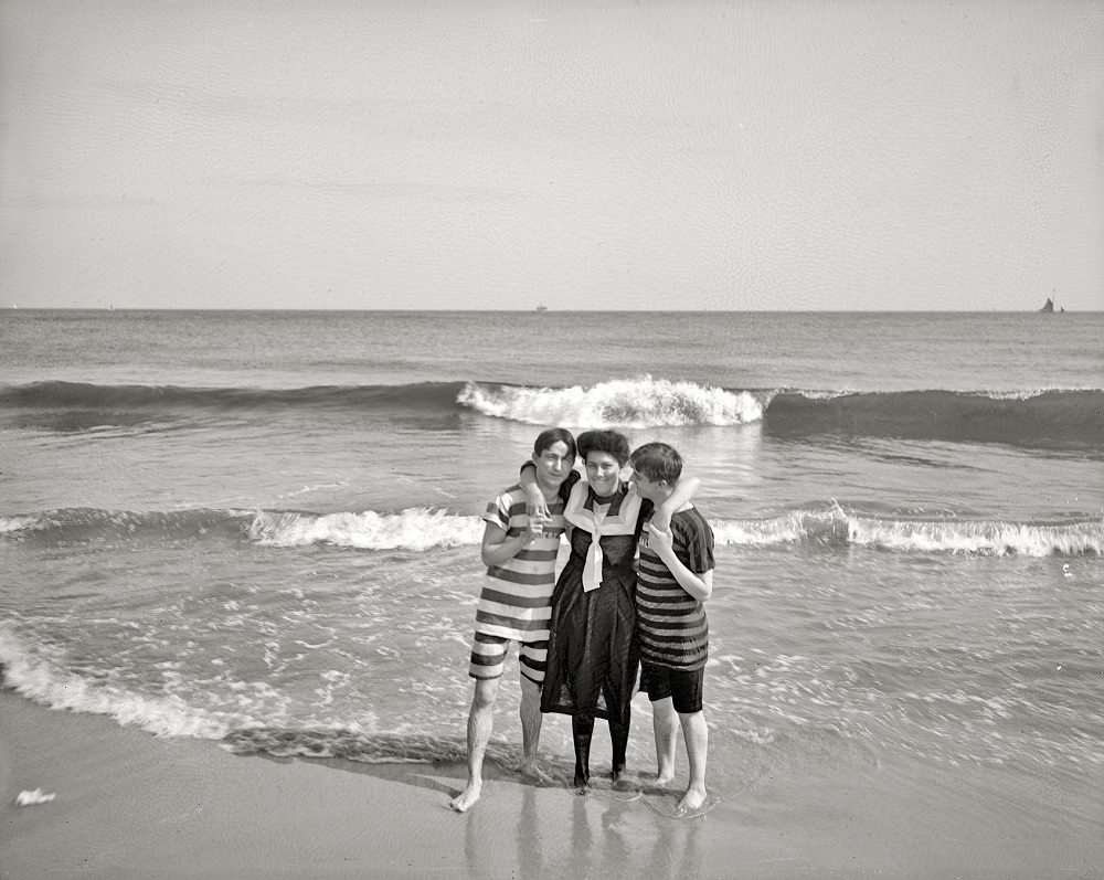 Two strings to her beaux, Coney Island, New York, circa 1905