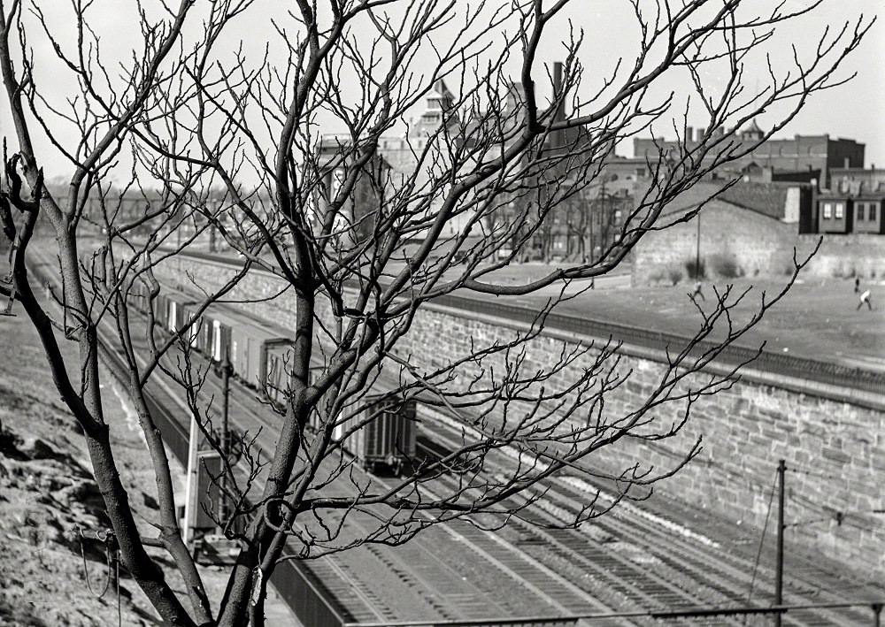 Reading Railroad tracks with an abandoned brewery in the background, Pennsylvania, Spring 1938