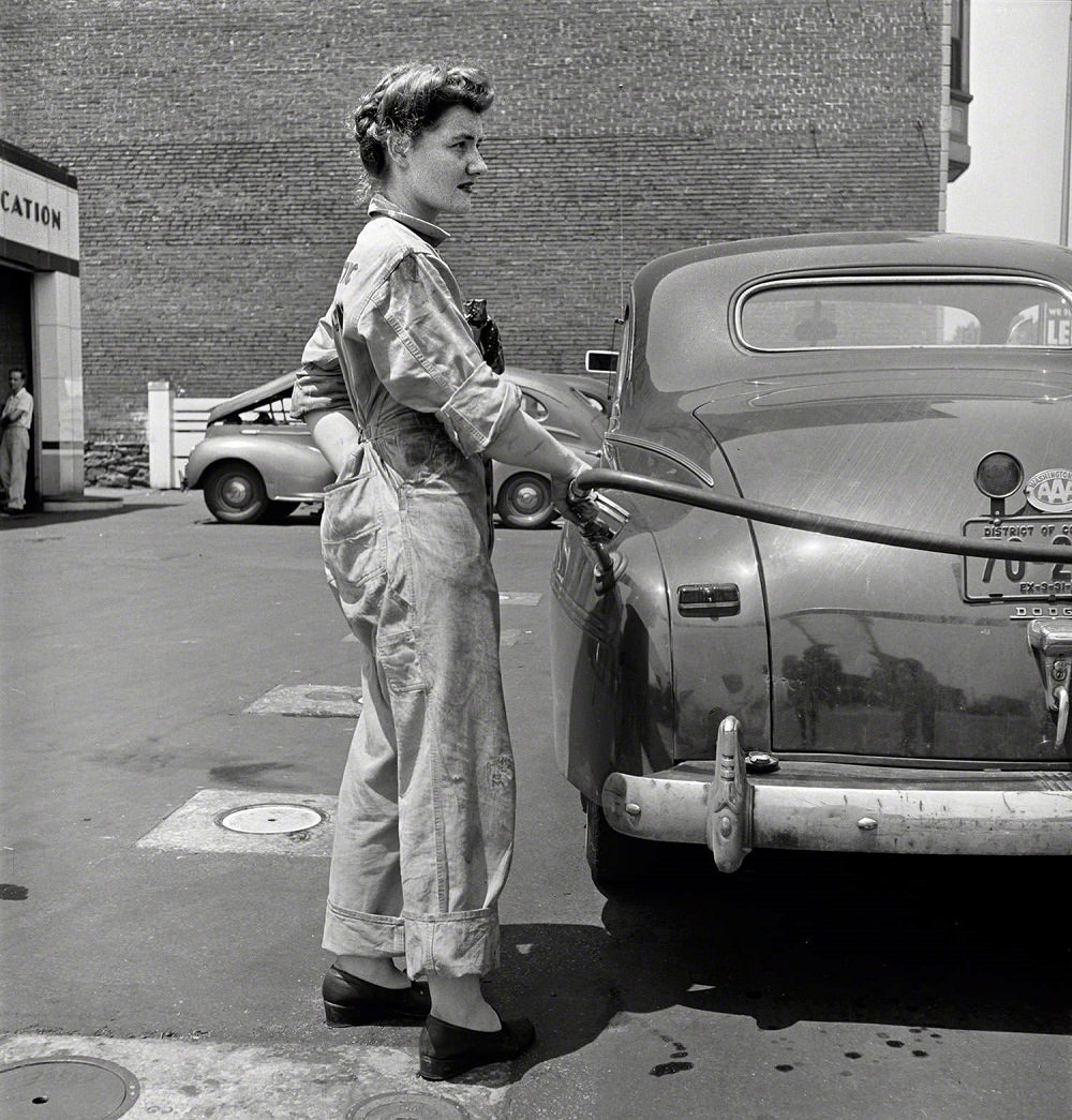 Miss Frances Heisler, pump attendant at one of the Atlantic Refining Company garages in Philadelphia, Philadelphia, June 1943