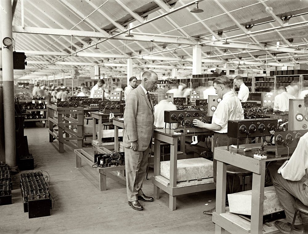 Atwater Kent at test table." Namesake of the Atwater Kent radio empire at his Philadelphia factory, 1925