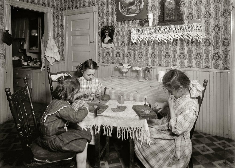 Girls 6, 9 and 11 years old, working on chain-bags in home of Mrs. Antonio Caruso, 132 Knight Street, Providence, November 1912