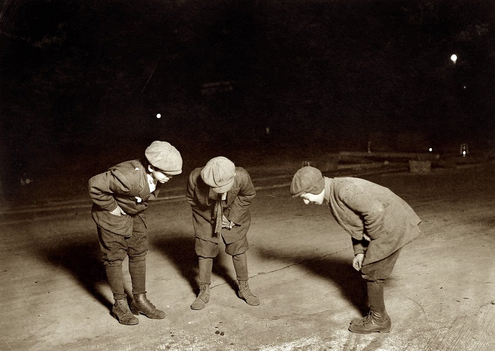 A midnight crap game in the street near the Post Office, Providence, Rhode Island, November 23, 1912