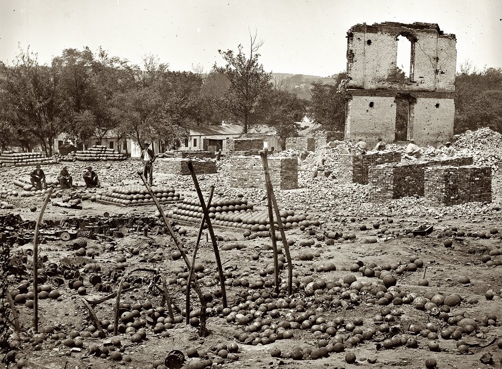 Ruins of the State Arsenal at Richmond showing stacked and scattered ammunition, April 1865