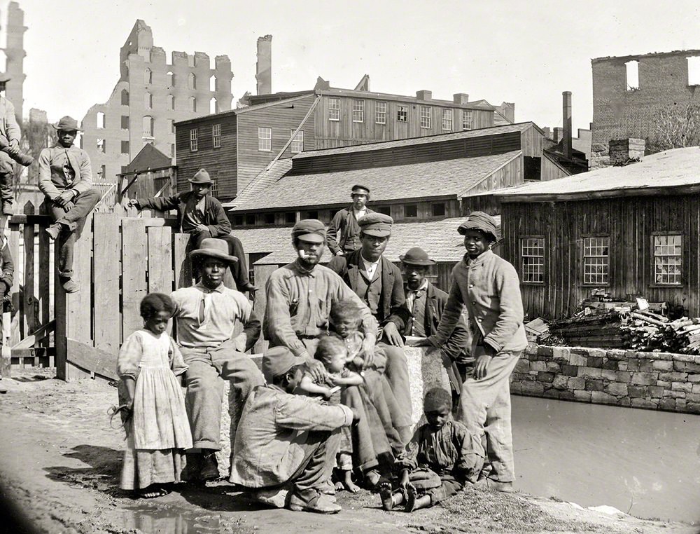 Negro freedmen by canal, a group of Contrabands at Haxall's Mill, Richmond, June 9, 1865