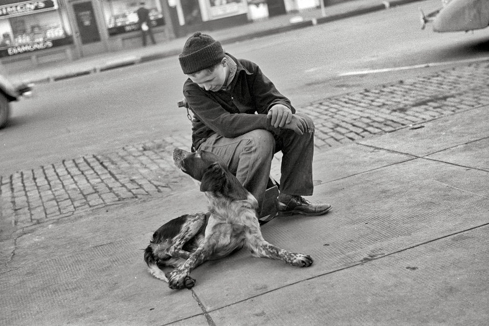 Boy with dog, Omaha, November 1938
