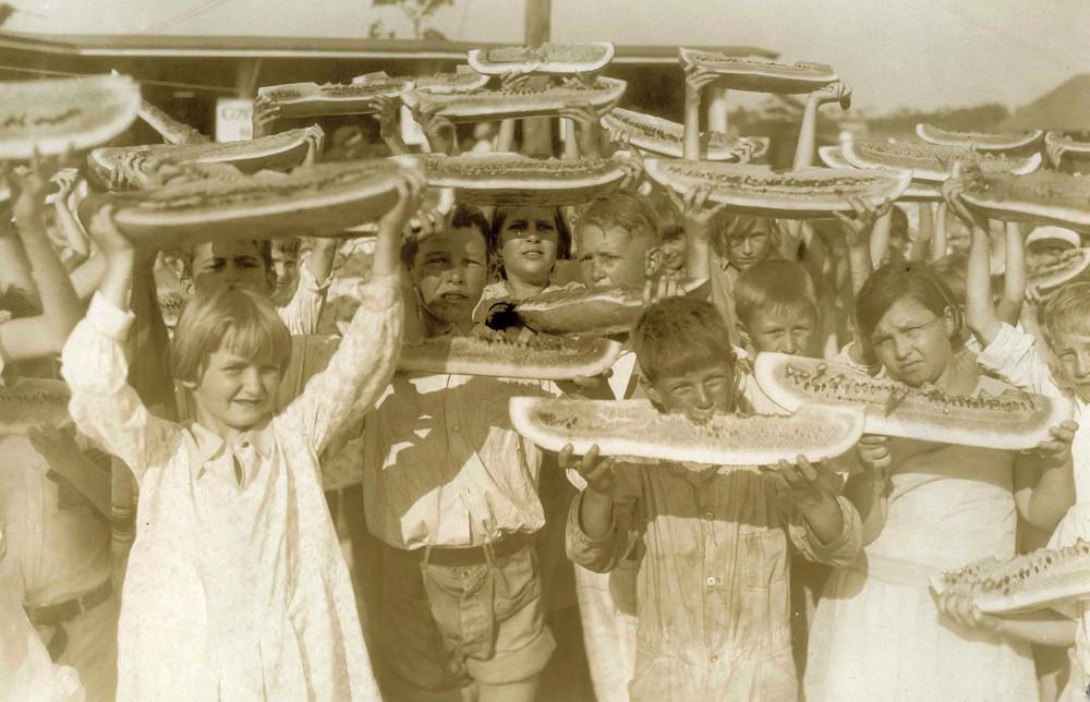 Kids eating watermelon during the Independence Day celebration in Bayview Park, Pensacola, 1908