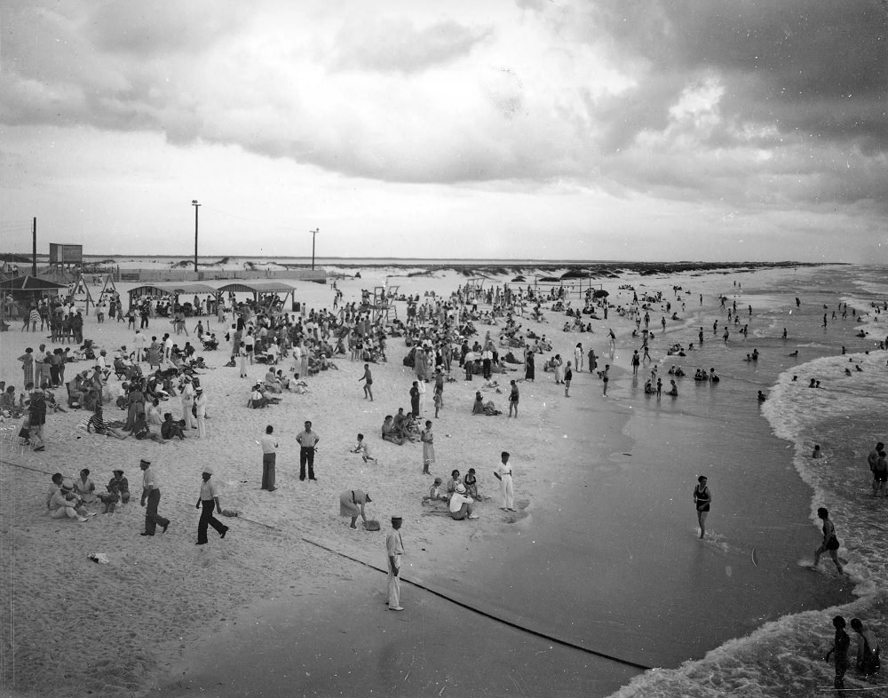 Crowds enjoying on the beach, Pansacola, 1930s