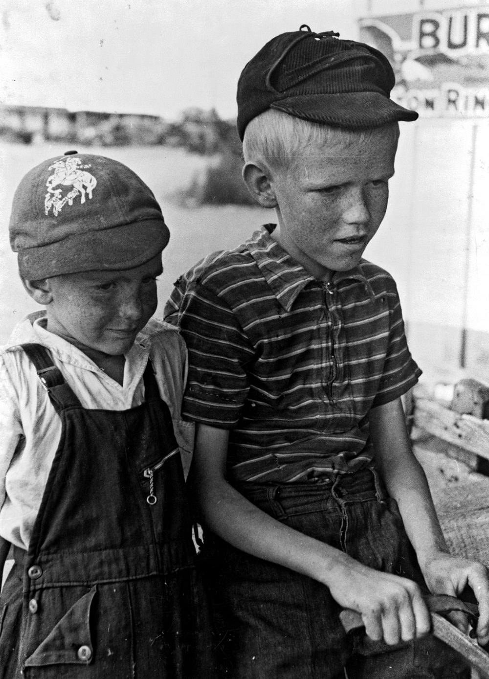 Sons of Mr. Leatherman ride in a burro-drawn cart in Pie Town, New Mexico, June 1940