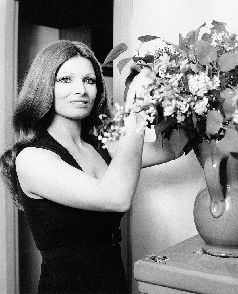 Scilla Gabel smiling with a vase of flowers, Rome, May 1968