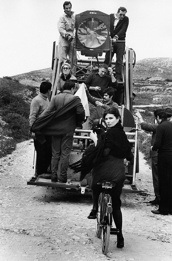 Scilla Gabel sitting on a bicycle on the set of the TV serial 'Vino e Pane', 1972