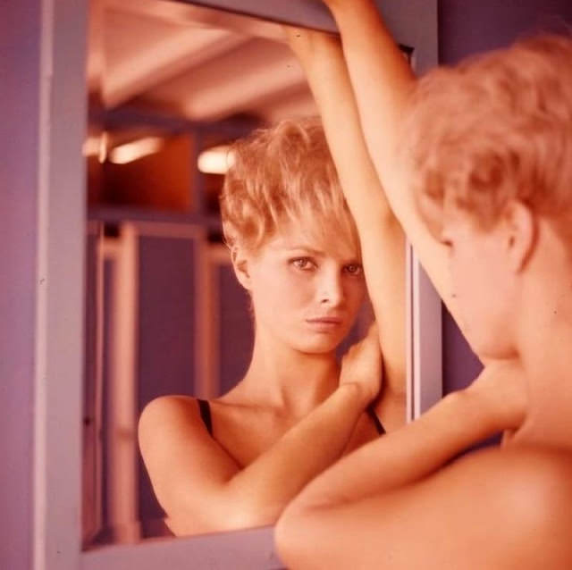 Scilla Gabel in front of a mirror, 1960s