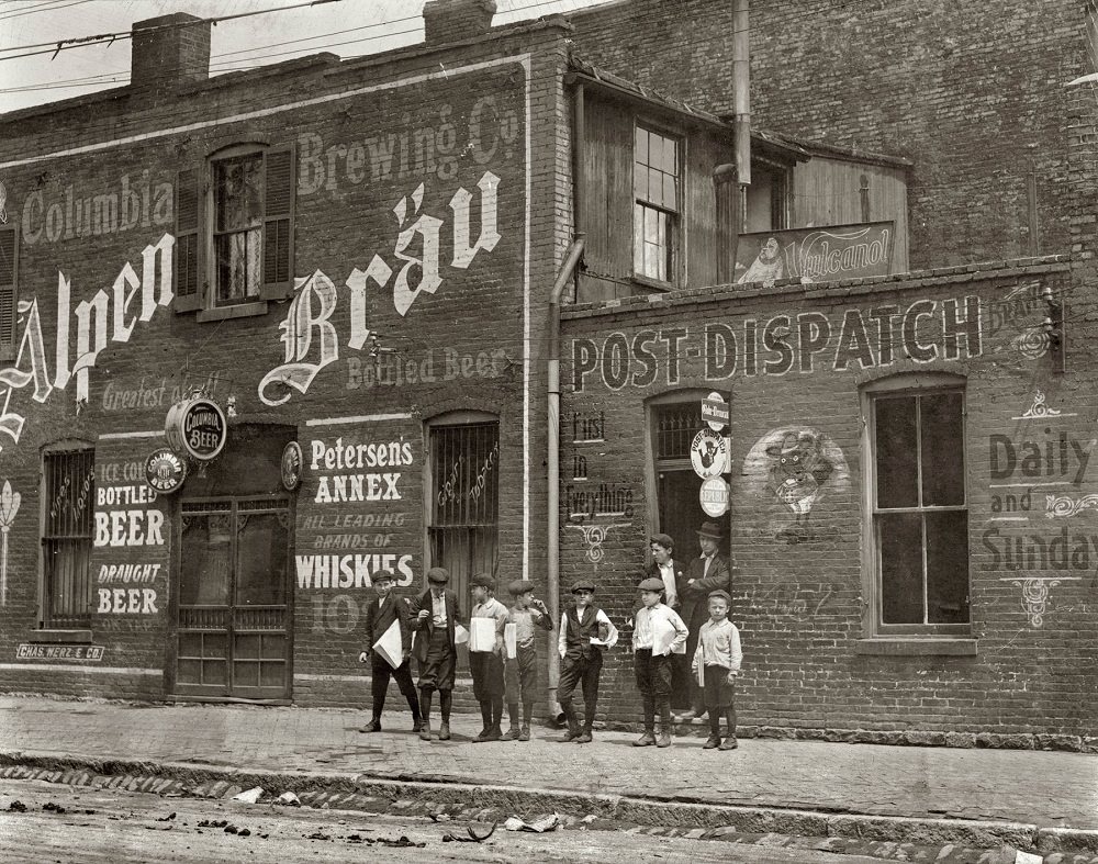 Newsies from Johnston's Branch adjoining Saloon at 10th & Cass Street, St. Louis, Missouri. May 1910