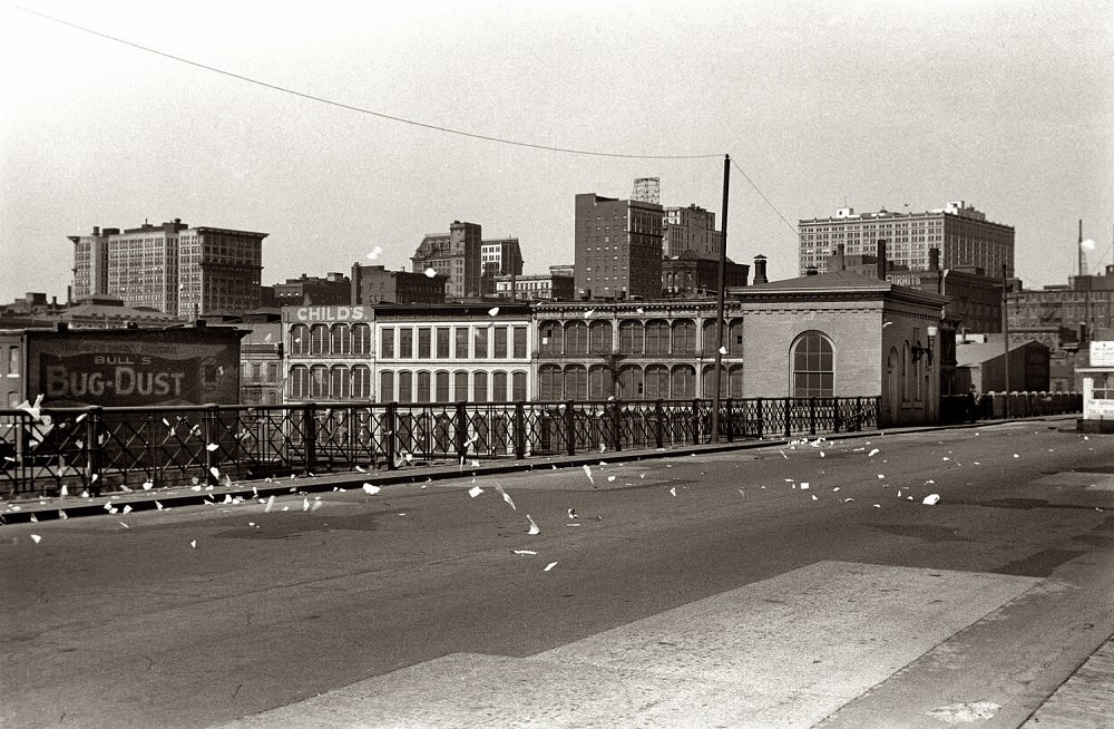 Scraps of paper blowing on bridge, St. Louis, Missouri, May 1940