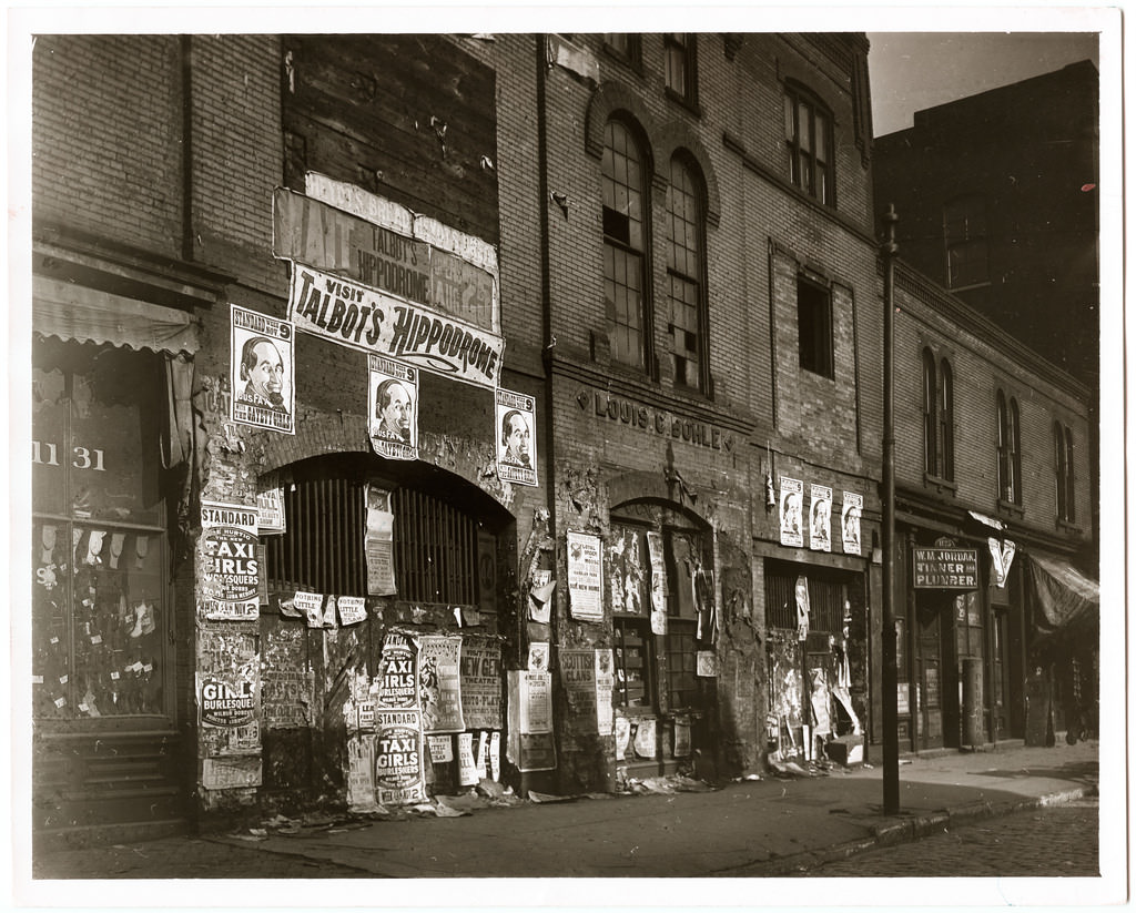 Posters covering a wall of the Louis Bohle Undertaking and Livery building at 1125–9 Market Street advertising vaudeville shows at the Talbot's Hippodrome, 1907