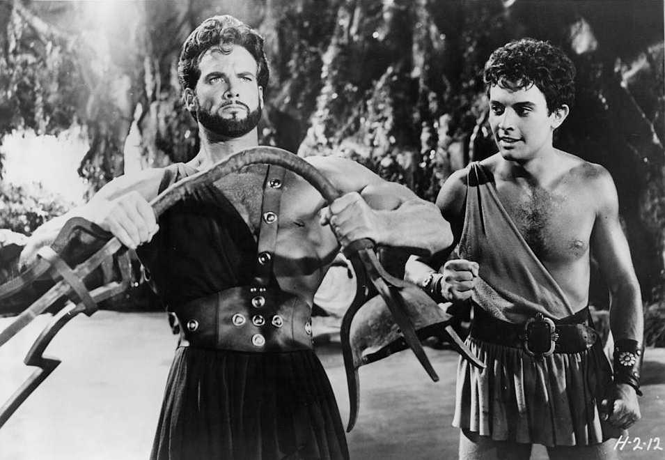 Steve Reeves bending metal in a scene from the film 'Hercules Unchained', 1959