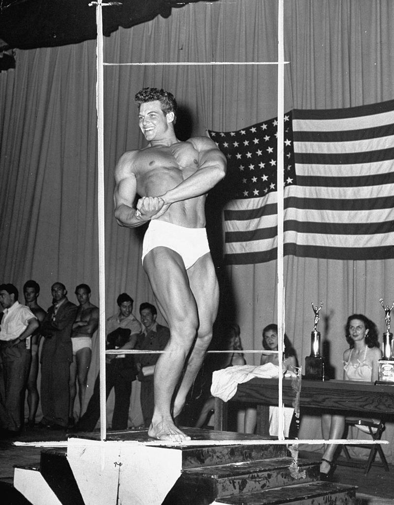 Steve Reeves posing after winning the Mr. America contest, 1947