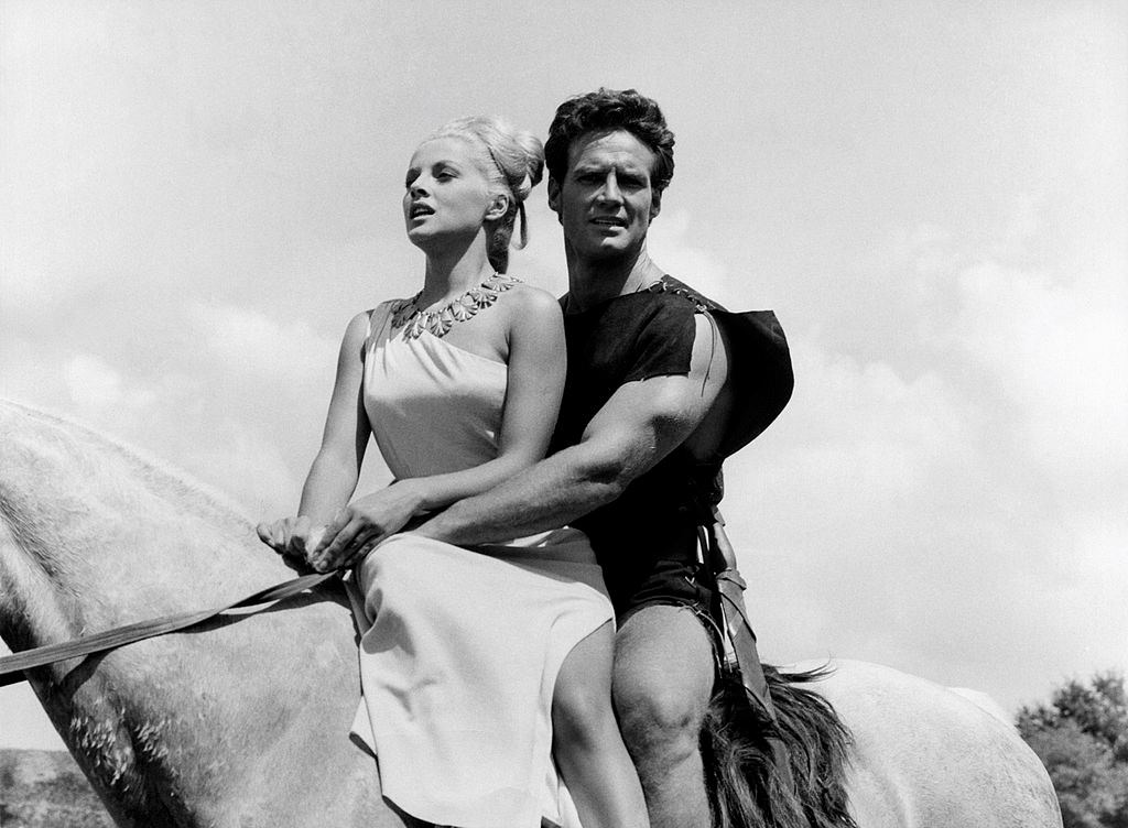 Steve Reeves with talian actress Virna Lisi acting on horse, 1961
