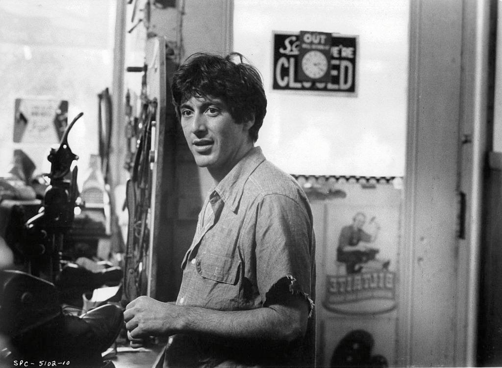 Al Pacino standing in a shoe repair store in a scene from the film 'Serpico', 1973.
